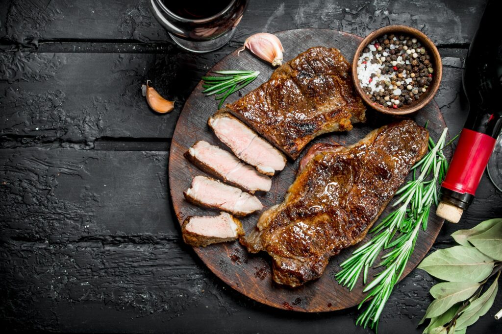 Grilled beef steak with red wine.